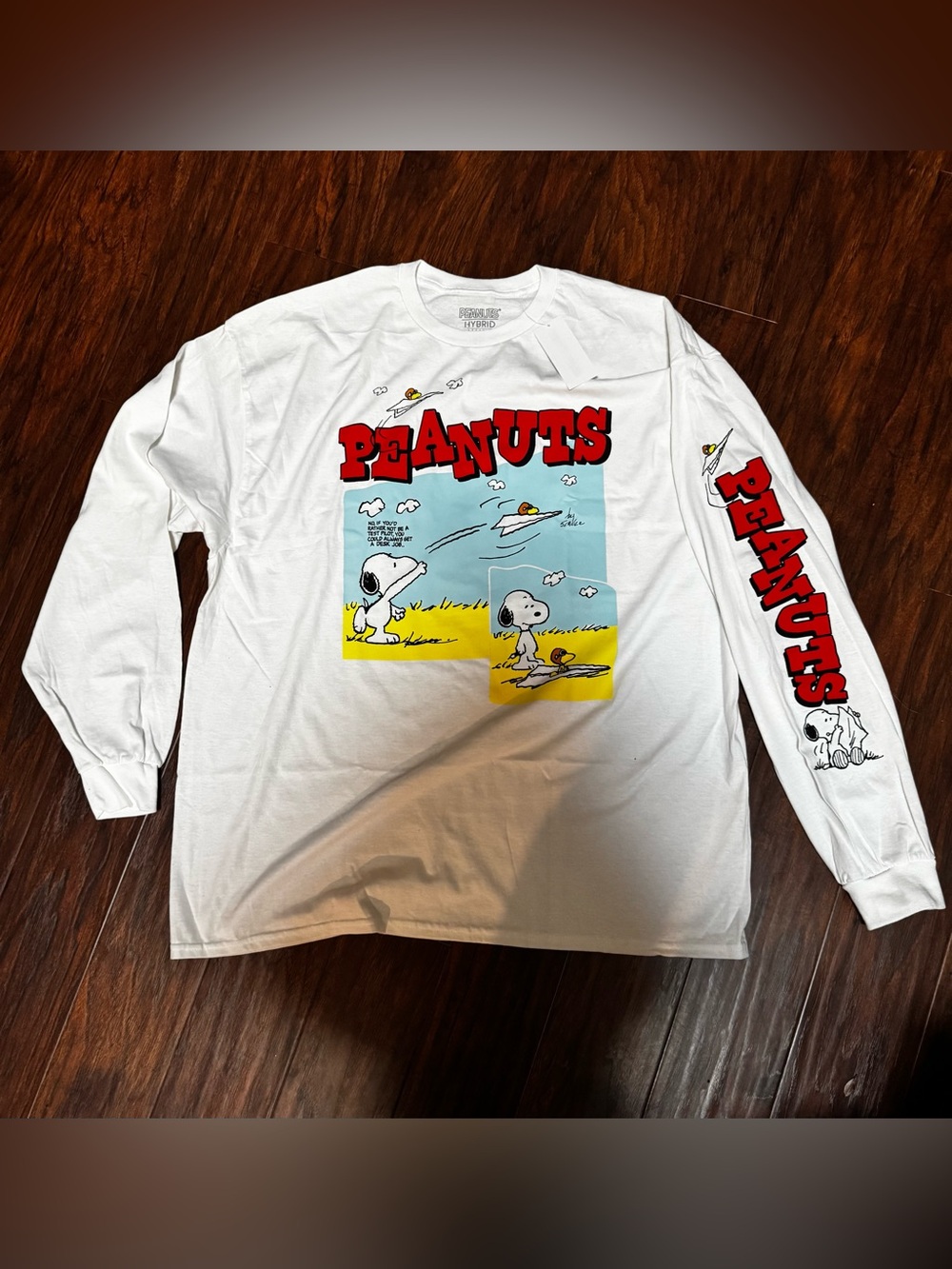 Peanuts White Long Sleeve Tee with Red Sleeve Logo & Colorful Snoopy Panel